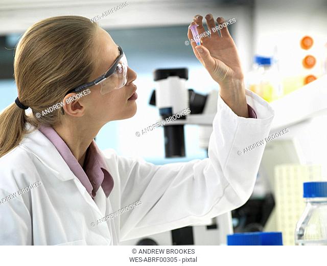 Scientist preparing a sample in a vial ready for analysis in the laboratory