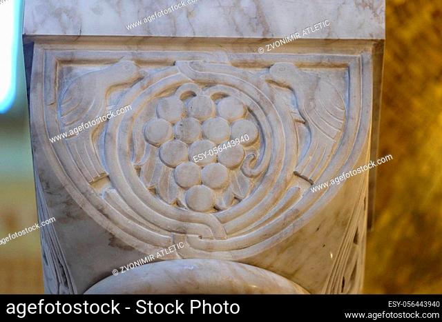 Grapes symbol Eucharist in a pillar in the church of Saint Blaise in Zagreb, Croatia