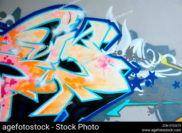 graffiti drawing on the smooth wall covered with a paint
