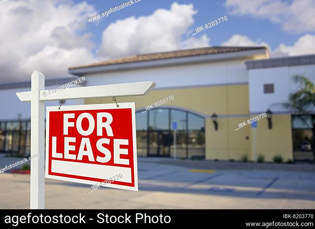 Vacant retail building with for lease real estate sign in front