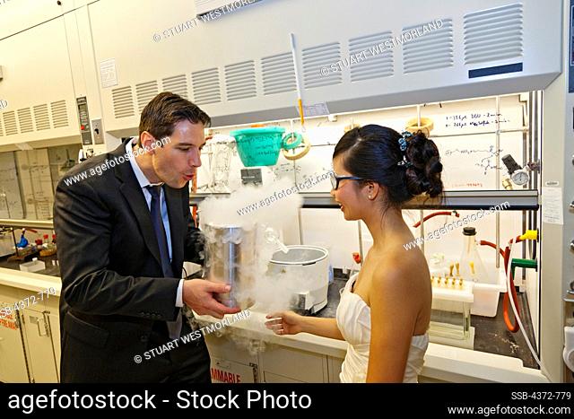 Bride and groom in laboratory where they studied together
