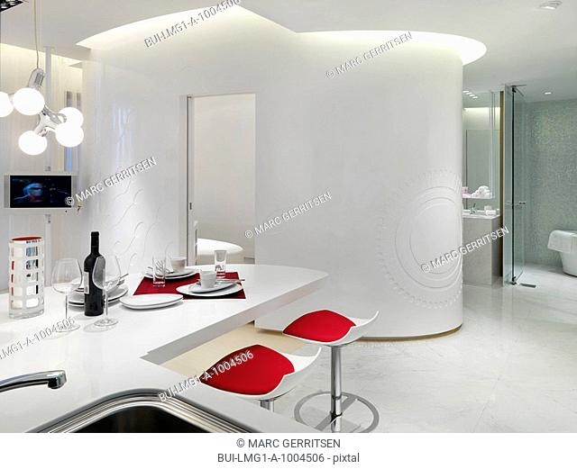White modern interior with red accents