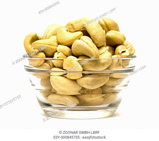 pistachios in a dish on white background