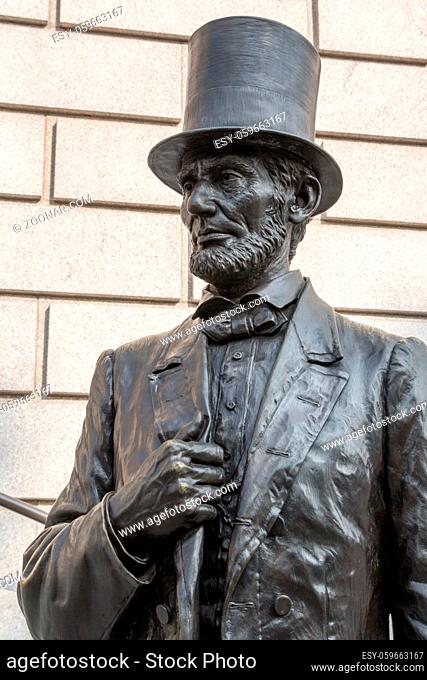 NEW YORK - JULY 30, 2014: Bronze sculpture of Abraham Lincoln on the stairs in front of a museum along central park in Manhattan, New York