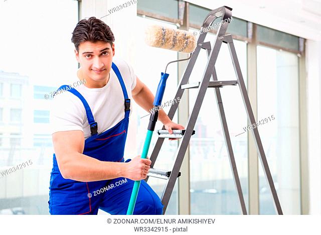 Painter repairman working at construction site