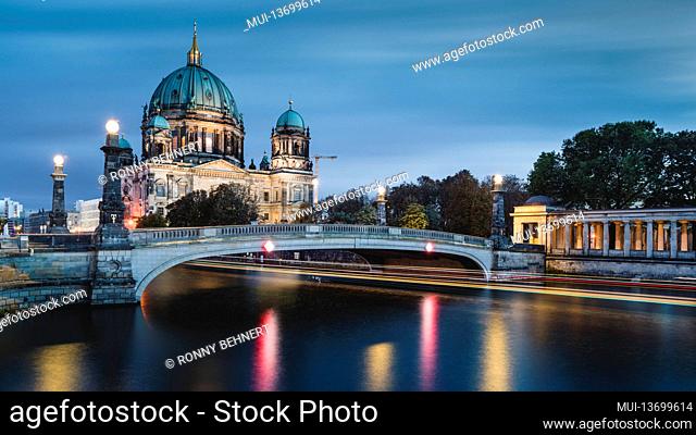 Shipping traffic on the Spree at the illuminated Berlin Cathedral on Museum Island at night