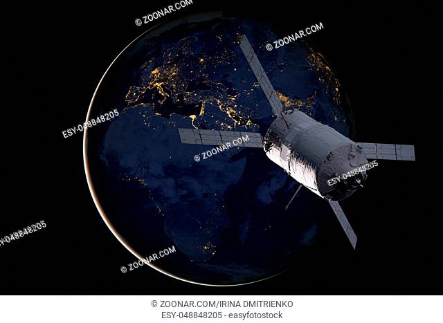 Cargo spacecraft - The Automated Transfer Vehicle over the planet Earth. Elements of this image furnished by NASA