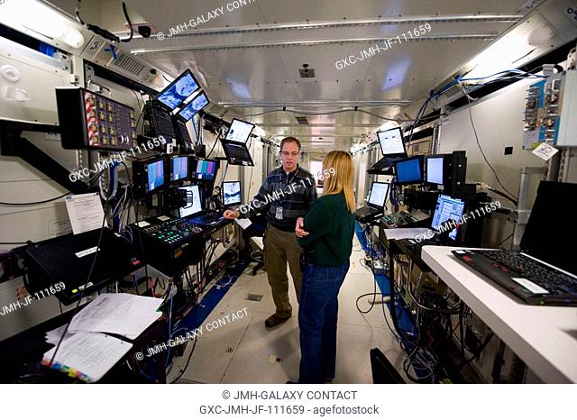 Astronaut Kathryn Hire, STS-130 mission specialist, participates in a robotics training session in an International Space Station mock-uptrainer in the Jake...