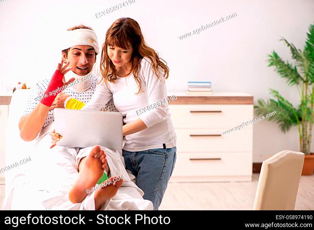Loving wife looking after injured husband