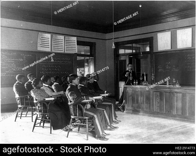 Students in class learning how to prepare sulphuric acid, Hampton Inst., Va., between 1899 & 1900. Creator: Frances Benjamin Johnston