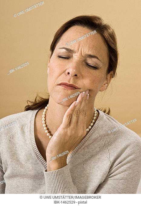Woman with a severe toothache