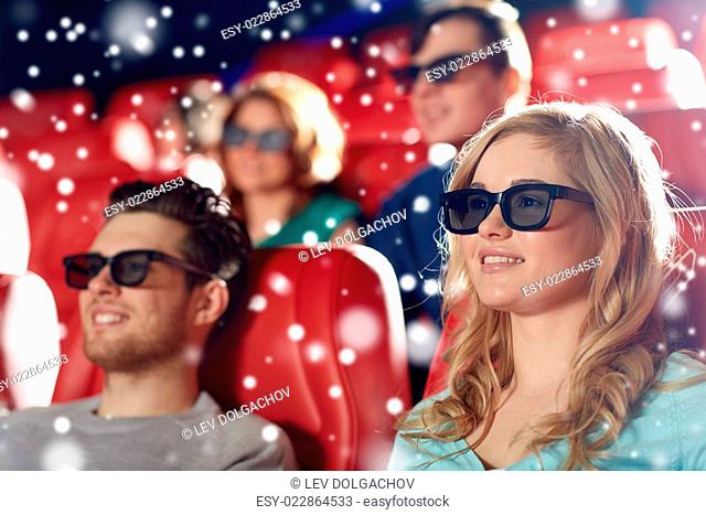 cinema, entertainment and people concept - happy friends with 3d glasses watching movie in theater over snowflakes