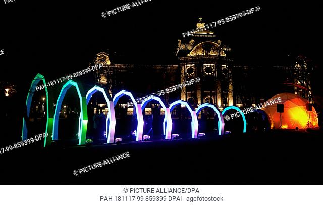 16 November 2018, Latvia, Riga: An illuminated installation forms a tunnel of electric arc in front of the Latvian National Art Museum