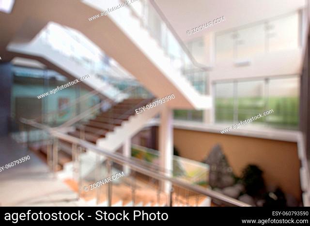 Blurred bokeh photo of stairs in office indoor hall