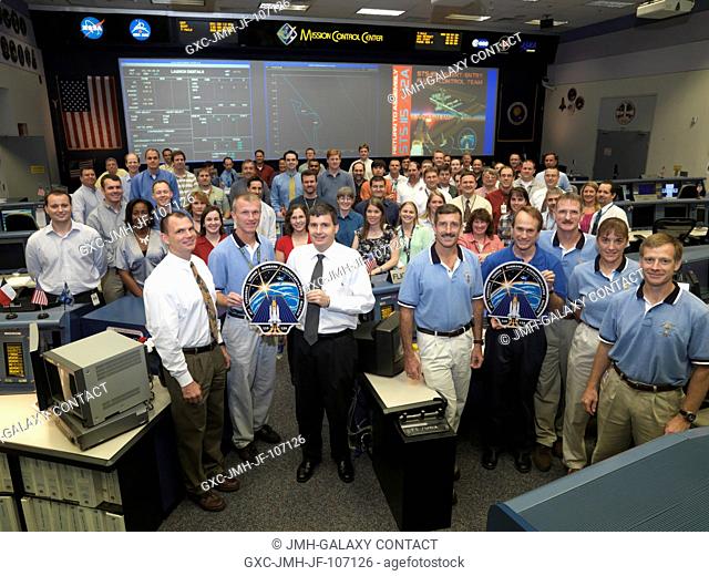 The members of the STS-115 AscentEntry flight control team and crewmembers pose for a group portrait in the Shuttle (White) Flight Control Room of Houston's...