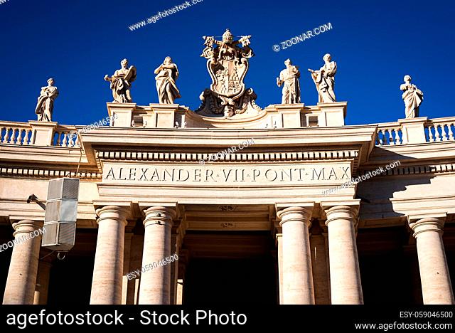Statues above the columns of the arches around St. Peter's Square at the entrance to the Vatican in Rome, Italy