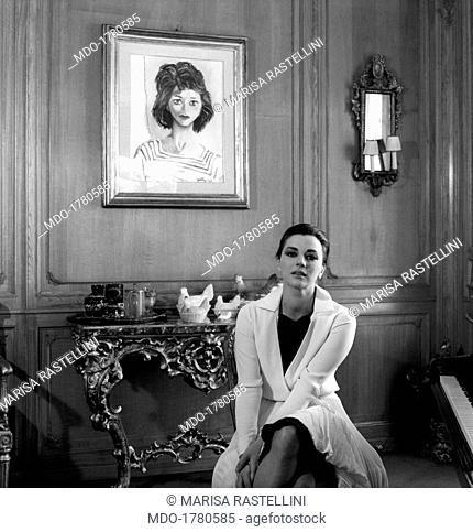 Giovanna Ralli sitting near a portrait made by Guttuso. Portrait of Italian actress Giovanna Ralli sitting at home near a portrait made by Italian painter...
