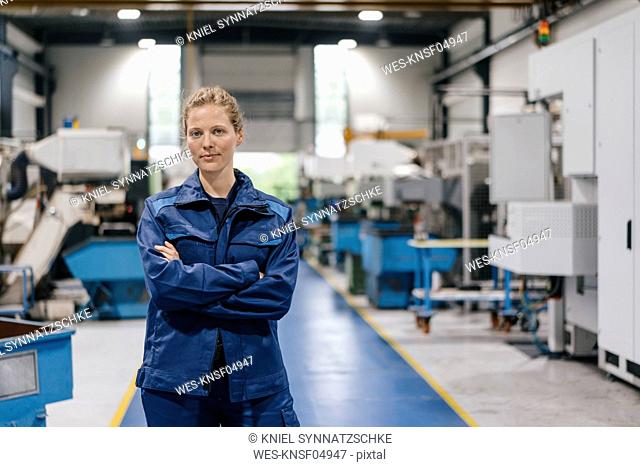 Young woman working as a skilled worker in a high tech company, portrait