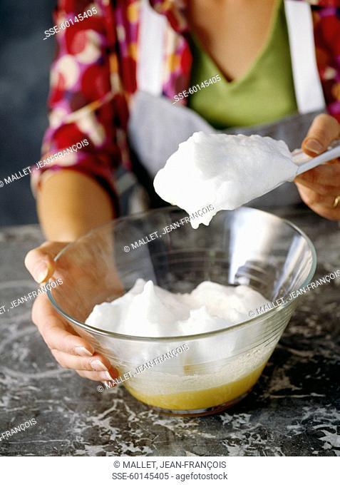 Adding the whipped eggs to the mixture