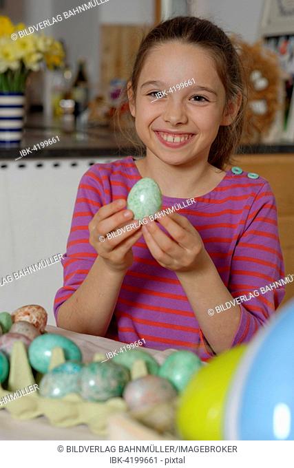 Girl colouring Easter eggs for the Easter basket, coloured eggs, Easter, Upper Bavaria, Bavaria, Germany
