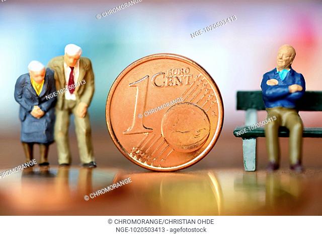Miniature figures of elderly people and one euro cent coin, old-age poverty