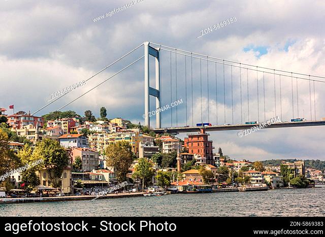 ISTANBUL - AUGUST 8: transport on and under Ataturk Bridge (Bosphorus Bridge), August 8, 2013 in Istanbul, Turkey. Ataturk Bridge is a first suspension bridge...
