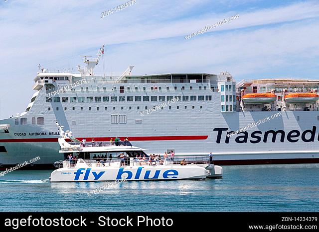 Malaga, Spain - May 24, 2019: A tourist yacht sailing in the harbour