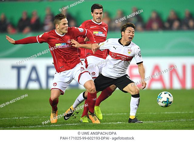 Stuttgart's Takuma Asano (R) being fouled in the penalty zone by Kaiserslautern's Joel Abu Hanna, which lead to a penalty kick for Stuttgart