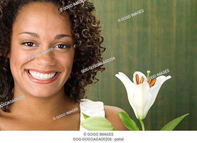 African woman with flower