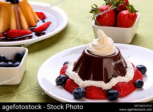 chocolate pudding with fruits and whipped cream