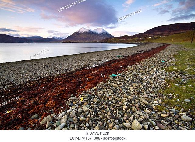 Scotland, Isle of Skye, Portree. The Braes, a group of villages near Portree on the island of Skye. In the distance are the Cuillin mountains