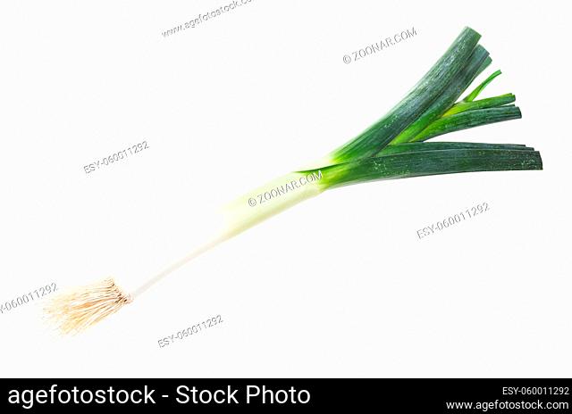 ripe leek with roots isolated on white background