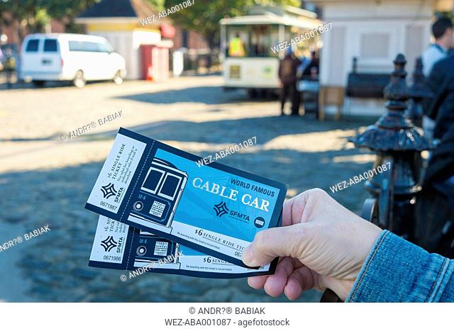 USA, California, San Francisco, Woman holding two tickets for the San Francisco Cable Car
