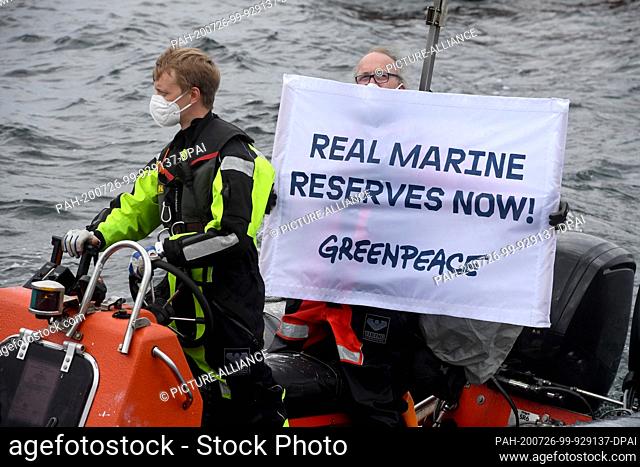 26 July 2020, Mecklenburg-Western Pomerania, Sassnitz: During a Greenpeace action on a rubber dinghy on the Baltic Sea off Rügen