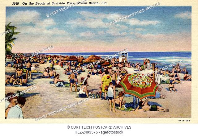 On the beach at Surfside Park, Miami Beach, Florida, 1938. Vintage linen postcard showing showing a beach scene at Surfside Park