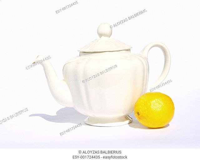 still-life with white teapot and lemon