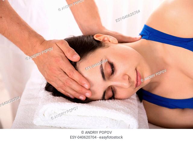 Close-up Of A Relaxed Young Woman Receiving Massage