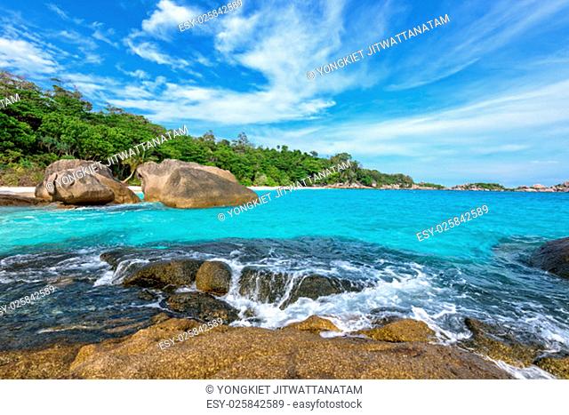 Beautiful landscape of blue sky sea and white waves on beach near the rocks during summer at Koh Miang island in Mu Ko Similan National Park, Phang Nga province
