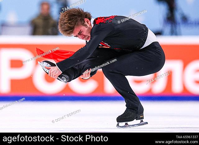 RUSSIA, CHELYABINSK - DECEMBER 21, 2023: Figure skater Mark Kondratyuk performs a sit spin during his men's short programme as part of the 2024 Russian Figure...