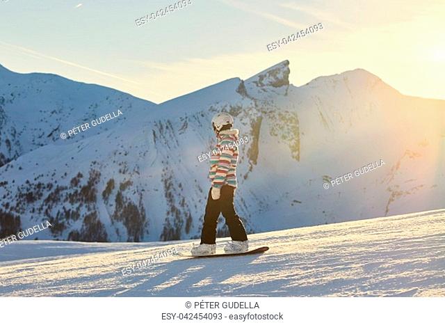 Snowboarding in the alps, sunlight flare, Val d'Allos iconic peaks in the background