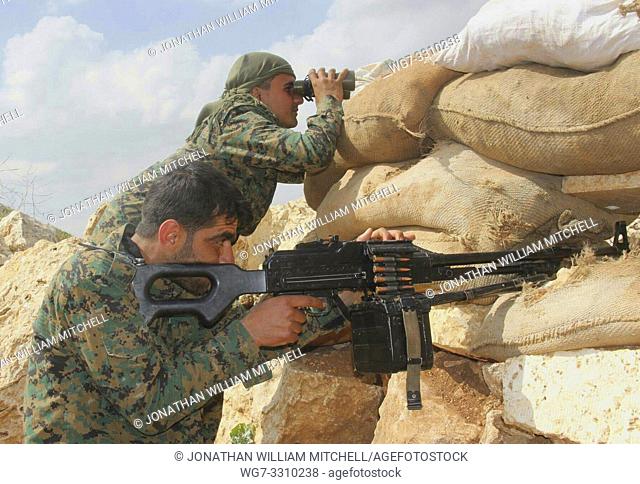 SYRIA / IRAQ -- circa 2016 -- Kurdish YPG fighters on the frontline somewhere in northern Syria or Iraq circa 2016 -- Picture by Atlas Photo Archive