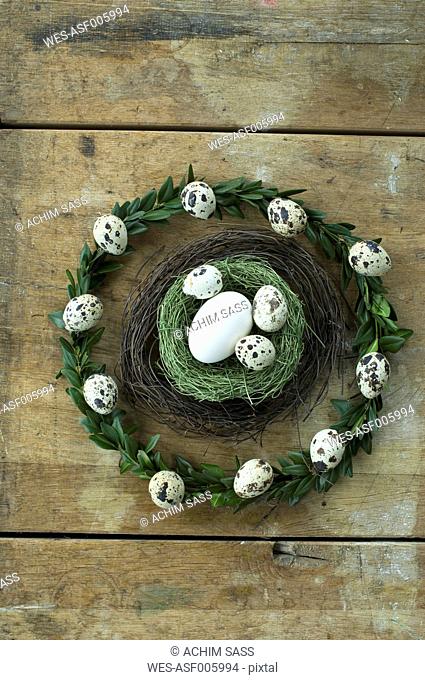 Easter wreath and Easter nest with goose egg and quail eggs