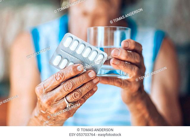Senior woman taking her daily prescripted medication
