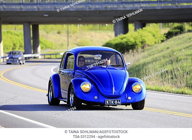 Salo, Finland. May 18, 2019. Classic royal blue 1970s Volkswagen Beetle, or Type 1 on road on the popular annual event Salon Maisema Cruising 2019