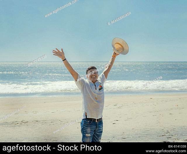 Happy handsome man on vacation outdoors, Happy latin young man on the beach, Tourist travel