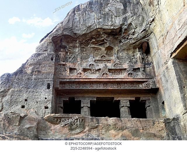 Cave 9 : Facade. The upper facade has six Chaitya arches with Buddha images in them. Standing Bodhisattvas flank these images on both sides