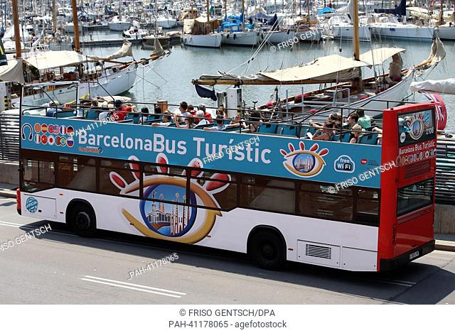 A touristic bus is seen at Moll de la Fusta (Port Vell) during the 15th FINA Swimming World Championships in Barcelona, Spain, 21 July 2013