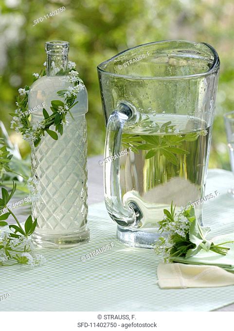 Lemonade with woodruff and a wreath around a bottle
