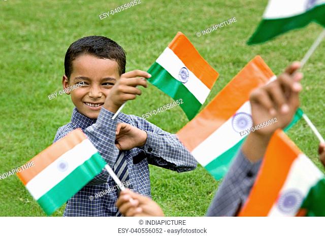 School boy holding the Indian Flag