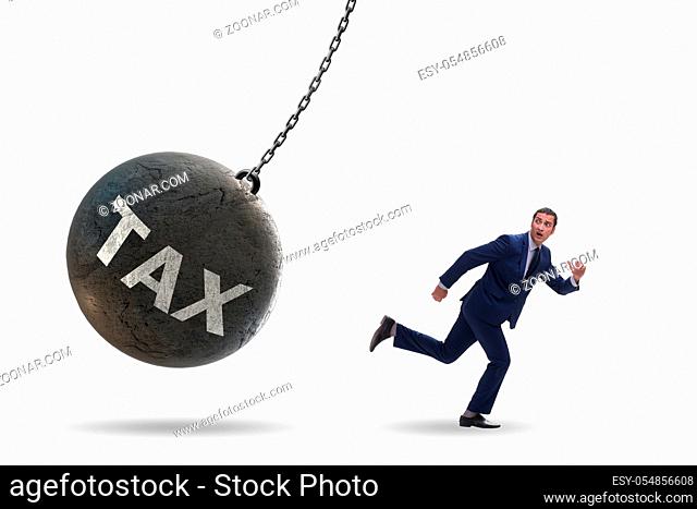 Businessman running away from high taxes